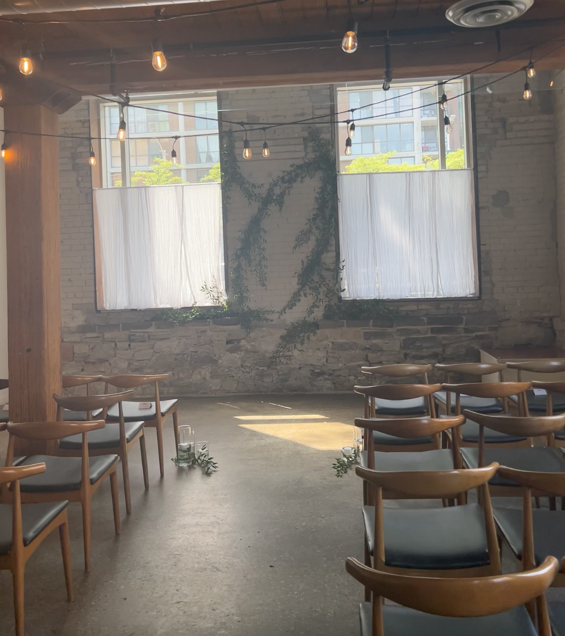 Hotel Ocho ceremony room with a greenery installation