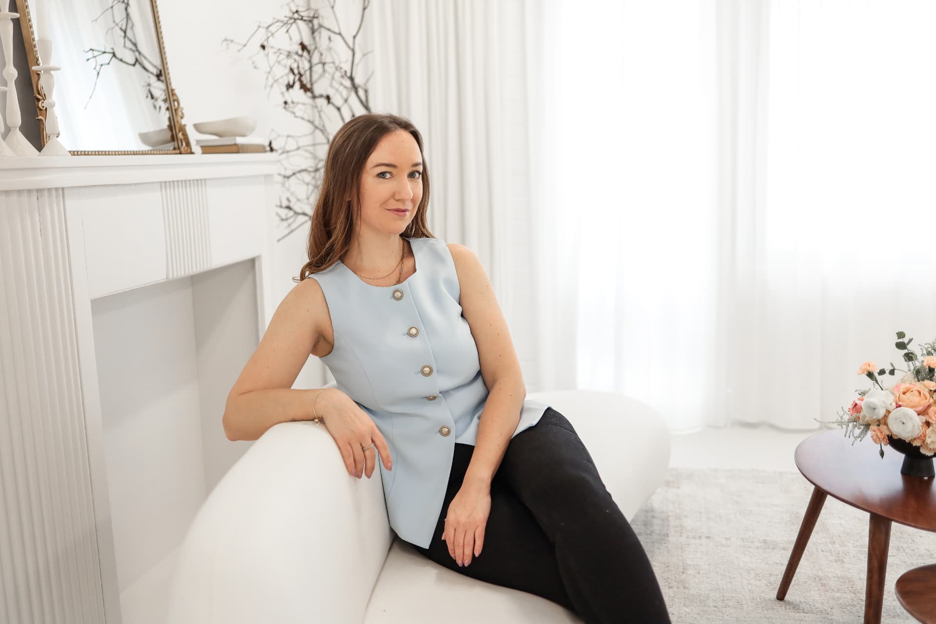 Kat, Blooming’s lead wedding coordinator, seated in a bright studio