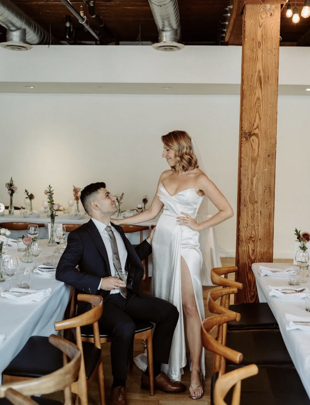 A newlywed couple in the Hotel Ocho reception room